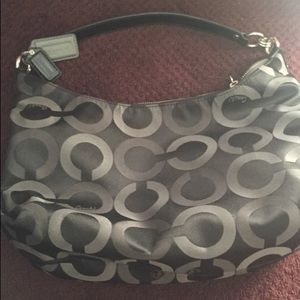 Black and silver coach handbag.